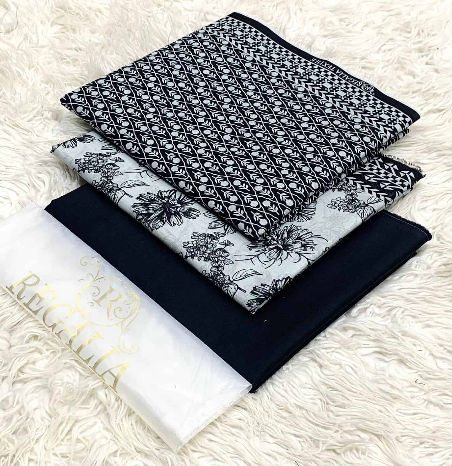 EGALIA-BLACK & WHITE-SERIES 2026 10 Elegant black and white traditional attire with intricate patterns, perfect for cultural events and.
