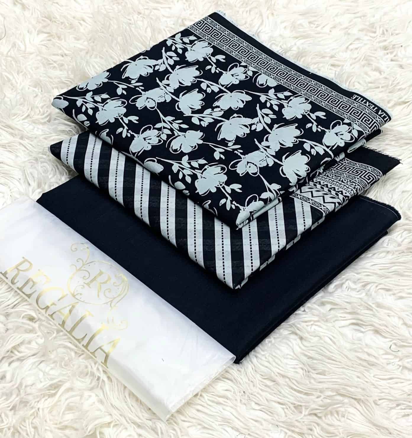 EGALIA-BLACK & WHITE-SERIES 2026 8 Elegant navy and white traditional attire with floral and geometric patterns, perfect for cultural o.